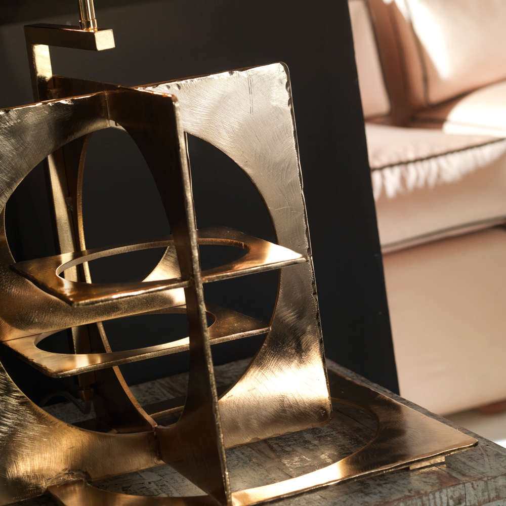 Table lamp in hand emery and engraved steel, aged gold finish. Black
chintz lampshade with golden inside.